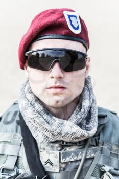Portrait of United states airborne infantry corporal wearing maroon beret