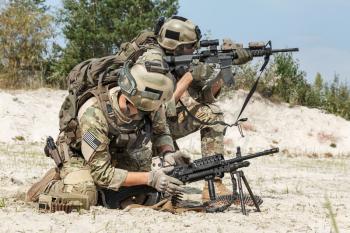 Members of US Army Rangers machinegun crew during the fight in the desert