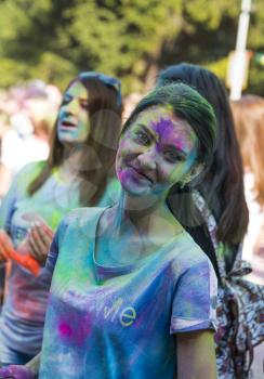 Lviv, Ukraine - August 30, 2015: Girl have fun during the festival of color in a city park in Lviv. 