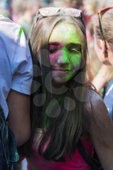 Lviv, Ukraine - August 30, 2015: Girl  have fun during the festival of color in a city park in Lviv.