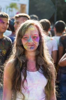 Lviv, Ukraine - August 30, 2015: Girls  have fun during the festival of color in a city park in Lviv.