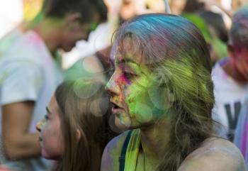 Lviv, Ukraine - August 30, 2015: Girl have fun during the festival of color in a city park in Lviv.