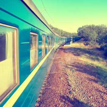 Motion train and blue wagon. Urban transportation. Modern colorization