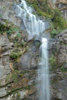Beautiful high tibetan waterfall in the mountains