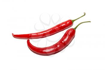 Two red hot chili peppers isolated on white.