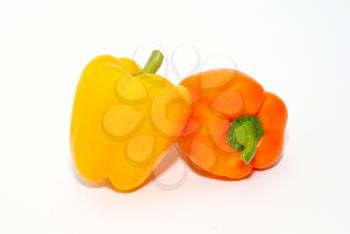 Orange and yellow paprika isolated on white.