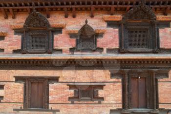 Old wooden doors of buddhistic house. Baktaphur, Nepal