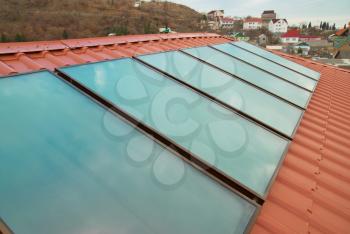 Solar panel (geliosystem) on the red roof.
