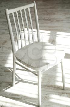 Empty old wooden chair isolated on light background.