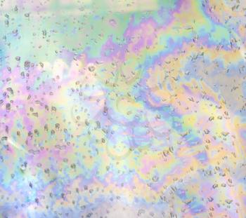 Holographic background with raind drops. Trendy colorful texture in neon color design. Iridescent pastel color scheme.