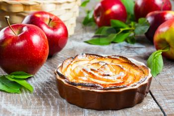 Puff apple shaped roses pie. Homemade sweet apple dessert pie. Homemade apple rose pastry. 