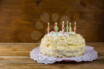 Birthday meringue cake with burning candles. Birthday Cake. Meringue cake. Pavlova. Birthday card