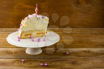 Burning candle on Birthday cake, copy space. Birthday Cake. Meringue cake. Pavlova. Birthday background.  Birthday card.