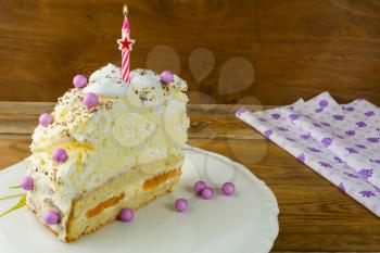 Candle on Birthday cake, copy space. Birthday Cake. Meringue cake. Pavlova. Birthday card. Birthday background.  