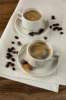 Coffee break on white linen napkin. Coffee cup. Cup of coffee. Strong coffee. Morning coffee. Coffee break. Coffee mug.  