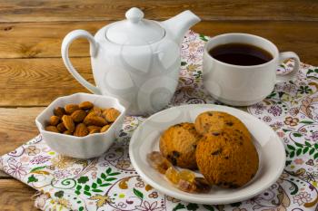 Cup of tea and teapot. Sweet dessert. Homemade biscuit. Breakfast cookies. Sweet pastry