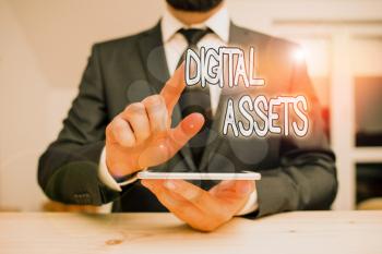 Word writing text Digital Assets. Business photo showcasing has value and can be owned but has no physical presence Male human wear formal clothes present presentation use hi tech smartphone