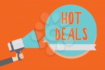 Conceptual hand writing showing Hot Deals. Business photo showcasing An agreement through which one of the paties is offered and accept Man holding megaphone blue speech bubble orange background