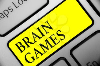 Conceptual hand writing showing Brain Games. Business photo showcasing psychological tactic to manipulate or intimidate with opponent Keyboard yellow key computer computing reflection document
