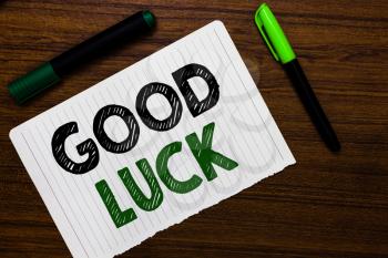 Conceptual hand writing showing Good Luck. Business photo text A positive fortune or a happy outcome that a person can have Notebook paper markers wooden background communicating ideas