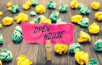 Writing note showing Open House. Business photo showcasing you can come whatever whenever want Make yourself at home Clothespin holding pink note paper crumpled papers several tries