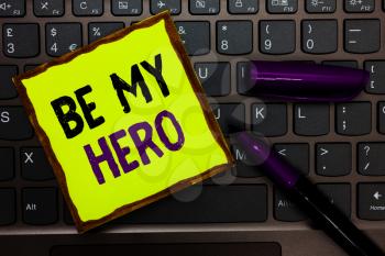Handwriting text Be My Hero. Concept meaning Request by someone to get some efforts of heroic actions for him Yellow paper keyboard Inspiration communicate ideas messages black markers