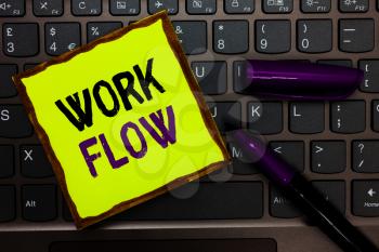 Handwriting text Work Flow. Concept meaning Continuity of a certain task to and from an office or employer Yellow paper keyboard Inspiration communicate ideas messages black markers