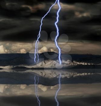 Lightnings strike in mountain landscape