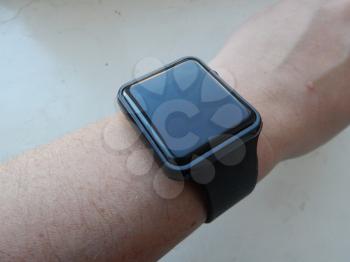 Wrist electronic smart watch is worn on the male hand