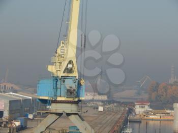 Port cranes for cargo transportation in the port logistics complex