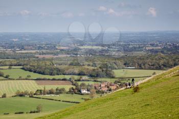 People waking  over the rolling Sussex countryside near Brighton