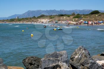 CABO PINO, ANDALUCIA/SPAIN - JULY 2 : People Enjoying the Beach at Cabo Pino Andalucía Spain on July 2, 2017. Unidentified people.