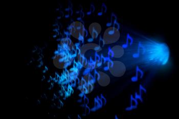 Defocused background with colorful bokeh in a shape of a music notes.