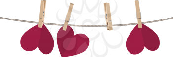 Colorful heart on a rope with wooden pegs.