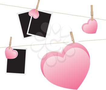 Retro photo frame and hearts on a rope with pegs.