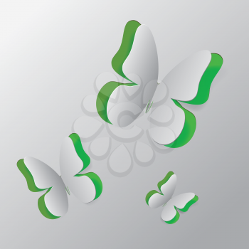 White paper with green background and cut out butterfly illustration.