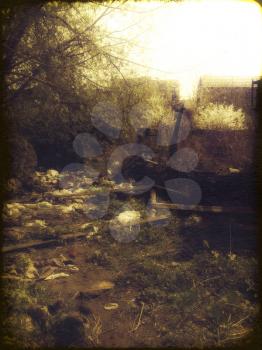 Remains of a burned down house, grunge retro photo effect.