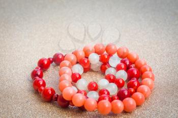 Boho bracelet made of white moonstone and red coral round beads.