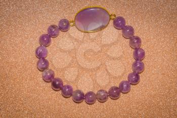 Fashion bracelet made of natural purple amethyst beads.