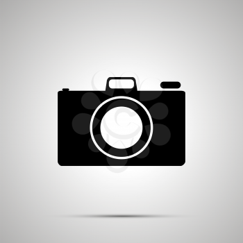 Photo camera silhouette, simple black icon with shadow