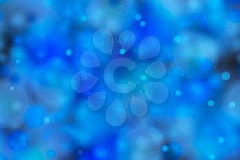 Bright blue magic light in the dark, abstract background