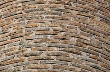 Detail of weathered factory brick chimney. Background texture.