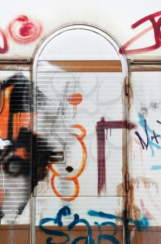 Graffiti on the door of a vandalized trailer caravan.