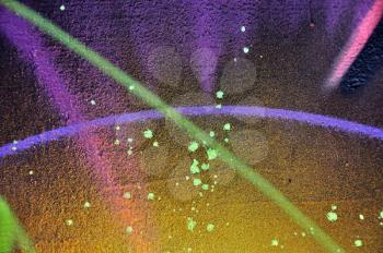 Paint splatter and colored lines on rough surface. Abstract artistic background.