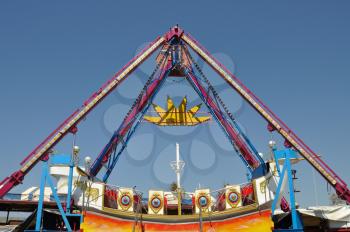 Colorful swing in amusement park. Abstract background.