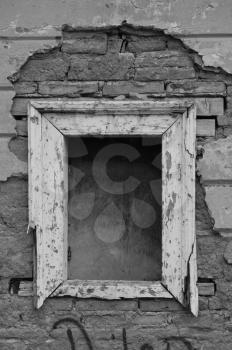 Empty window frame broken brick wall grunge background. Black and white.