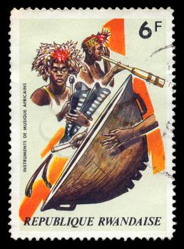 RWANDA - CIRCA 1973. Vintage canceled postage stamp with african musical instruments and traditional musicians illustration, circa 1973.