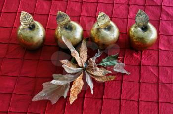Golden apples and plastic flower. Christmas vintage decorative objects.