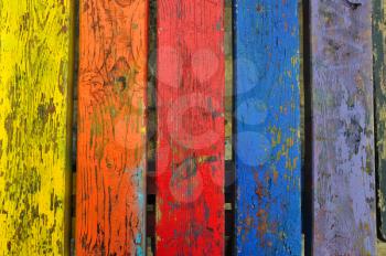 Chipped paint wood texture colorful planks weathered wooden boards abstract background.