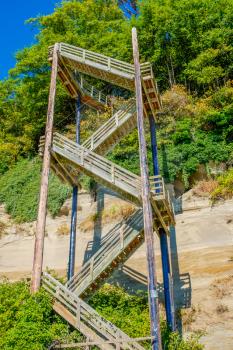 Stairs rise up nex to a hill at Saltwater State Park. HDR image.